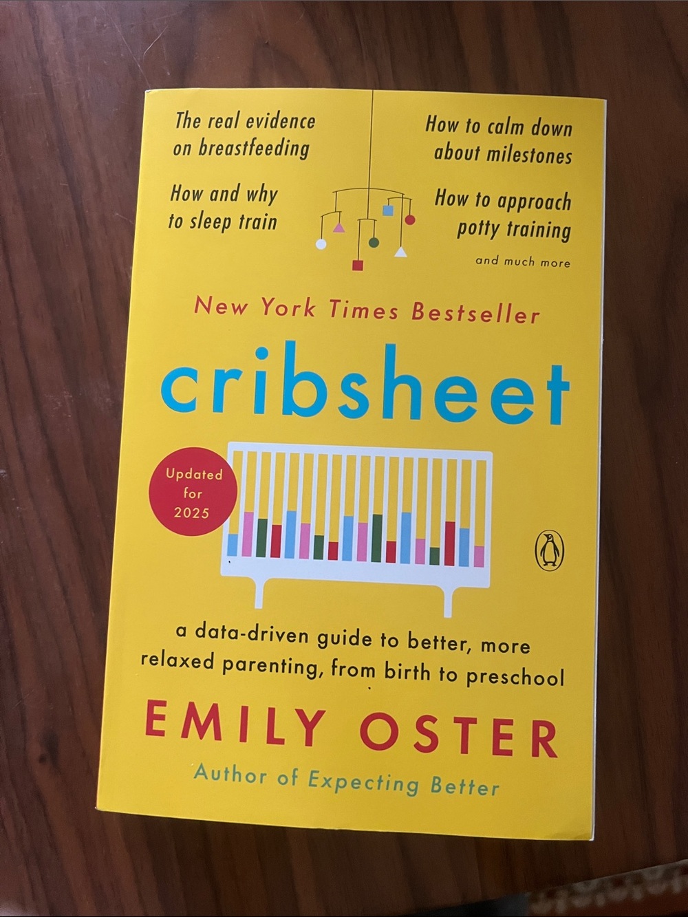 Cribsheet by Emily Oster - Yellow Paperback Parenting Guide